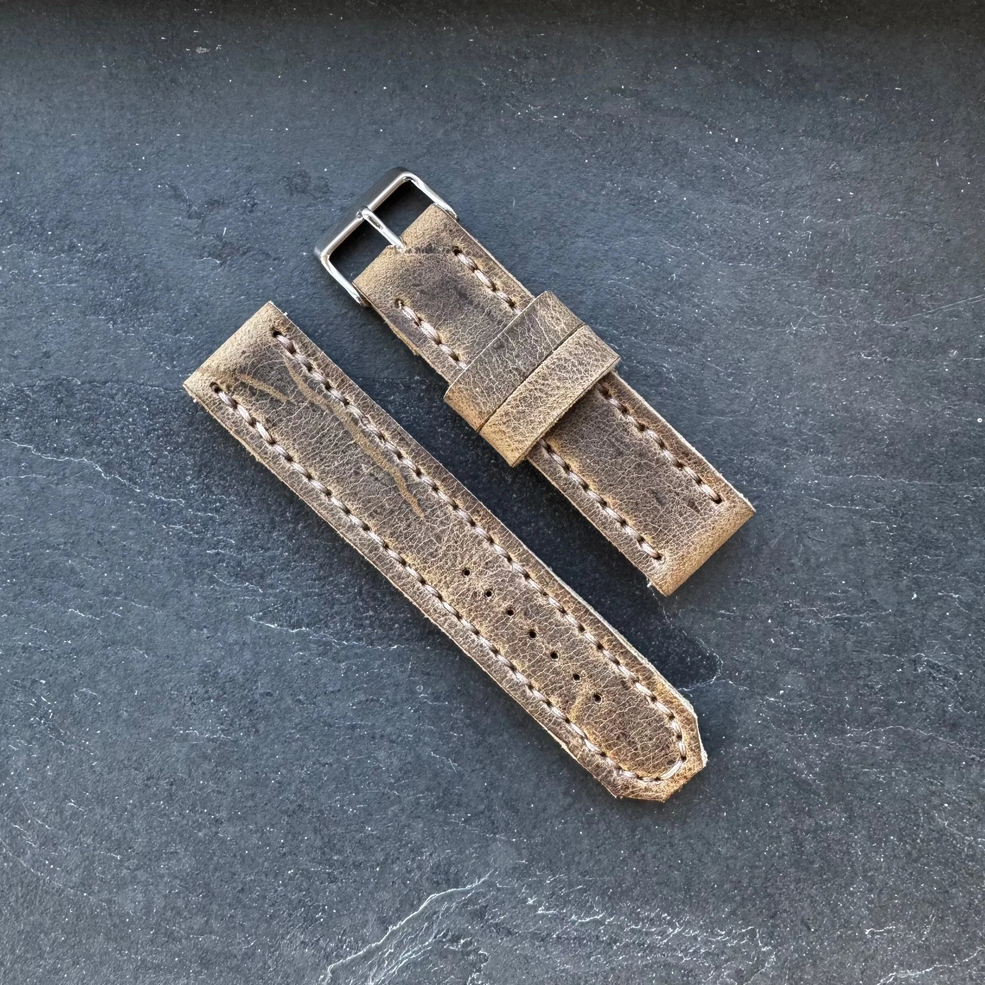 Handcrafted leather watch straps with raw edges and quick-release spring bars in Horween Chromexcel leather