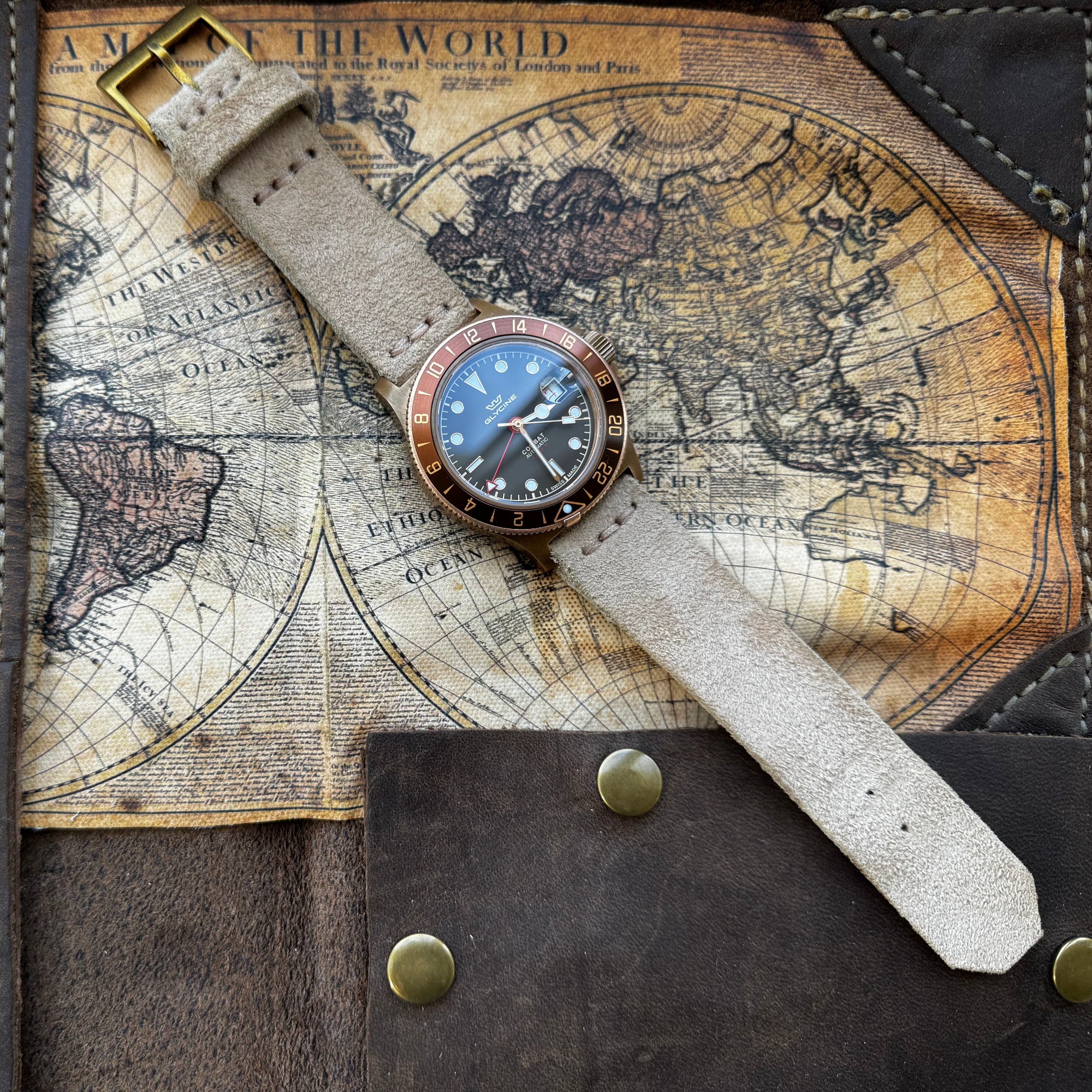No. 53 Explorer Leather Watch Straps – Suede, on Glycine Combat Sub Watch, Flat on Map Surface – Image