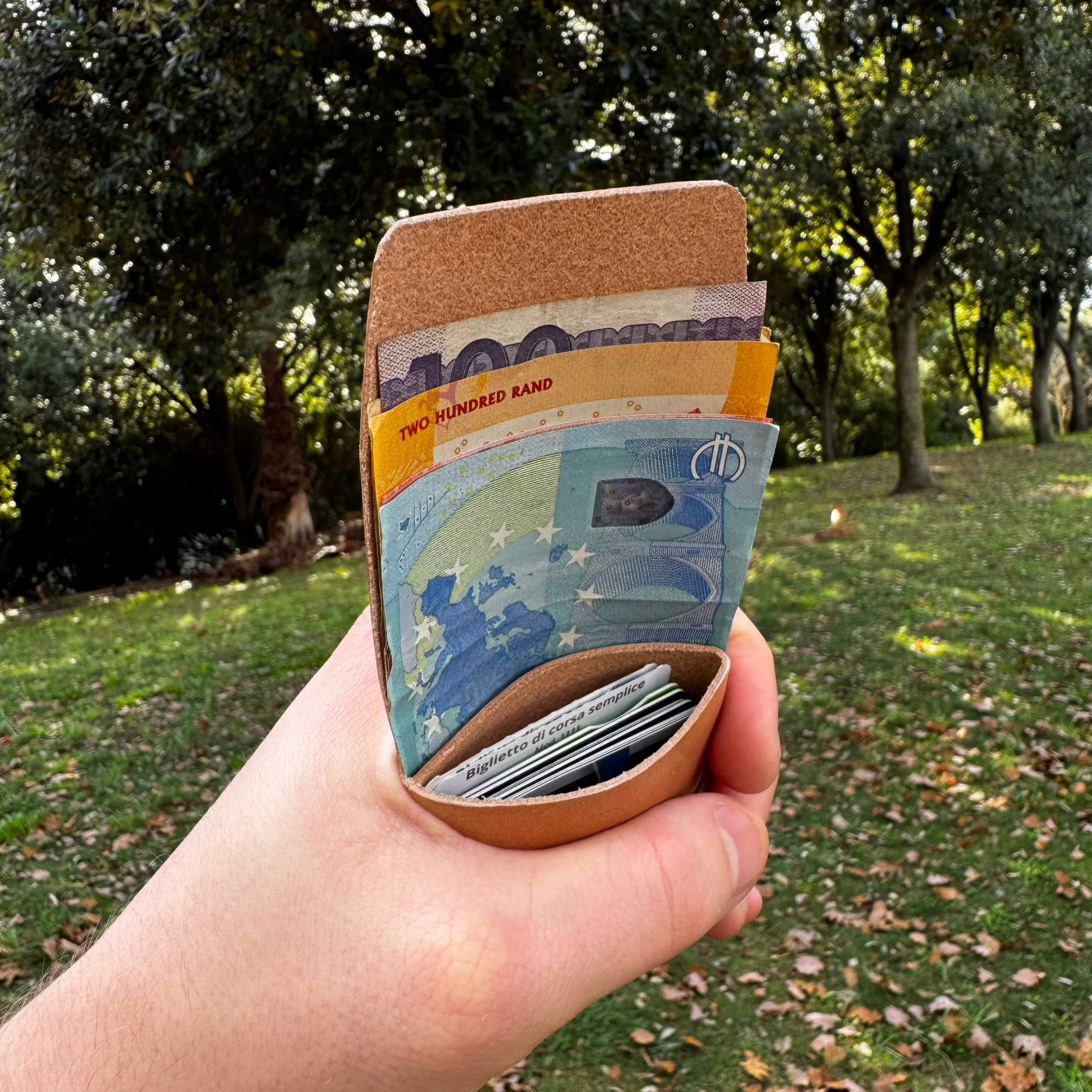 No. 66 Woodsman Leather Fold Wallet, Wicket and Craig Russet, Front Tilted Open with Cash 