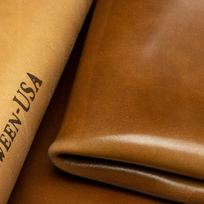 Close-up detail shot of premium Horween Bourbon Shell Cordovan leather, showcasing the authentic Horween-USA maker's stamp on the reverse side.