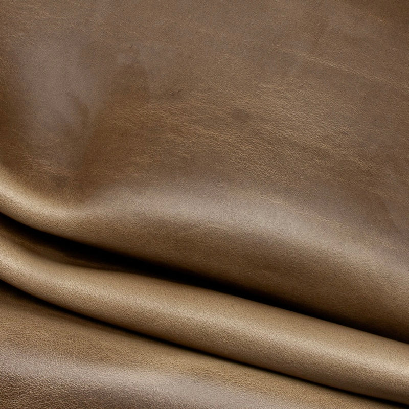 Detailed macro texture shot highlighting the natural tan tones and smooth, pliable grain of premium Horween Chromexcel leather.