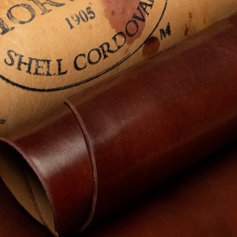 Detailed close-up shot of premium Horween Cognac Shell Cordovan leather, showcasing the authentic Genuine Horween Shell Cordovan 1905 maker's stamp on the reverse side.