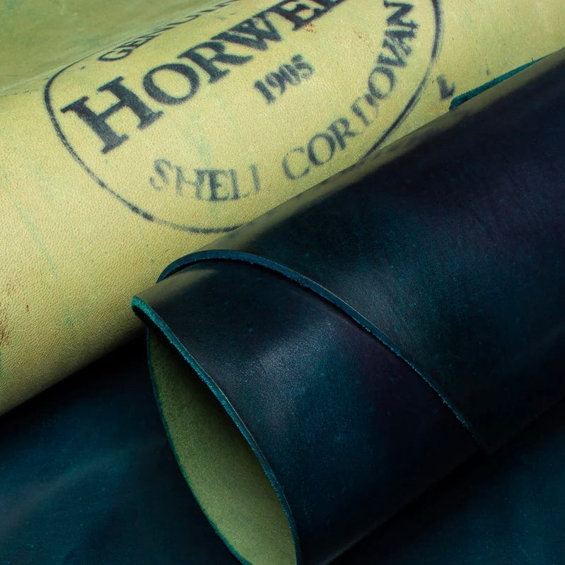 Close-up detail shot of premium Horween Navy Shell Cordovan leather, showcasing the authentic Genuine Horween Shell Cordovan 1905 maker's stamp on the reverse side.