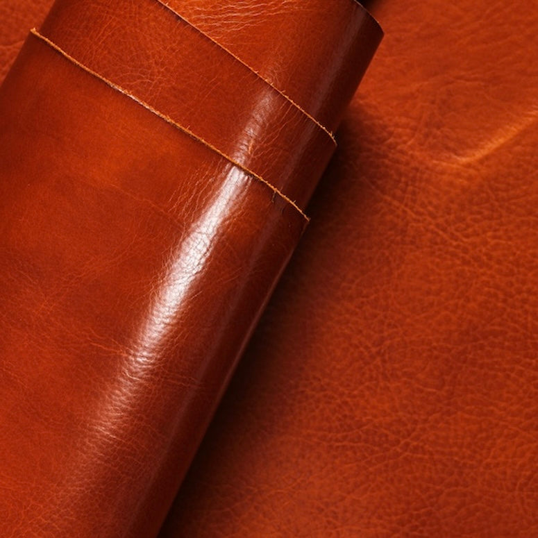 Close-up view of premium Tan leather from La Bretagna Tannery, highlighting the rich, natural grain, depth of color, and the smooth, luxurious finish of this high-quality hide.