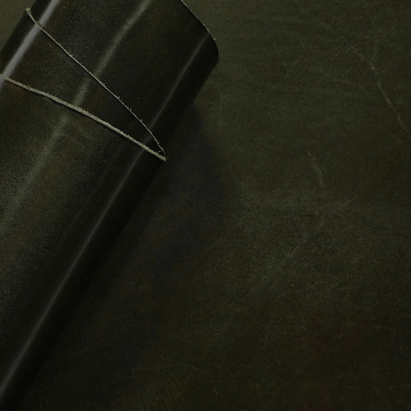 Close-up view of premium Vintage Green leather from La Bretagna Tannery, highlighting the rich, natural grain, depth of color, and the smooth, luxurious finish of this high-quality hide.