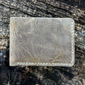 Handcrafted No. 1652 JAGTER field bifold wallet in rare Wild African Kudu leather, showcasing unique, rugged natural grain and scarring.