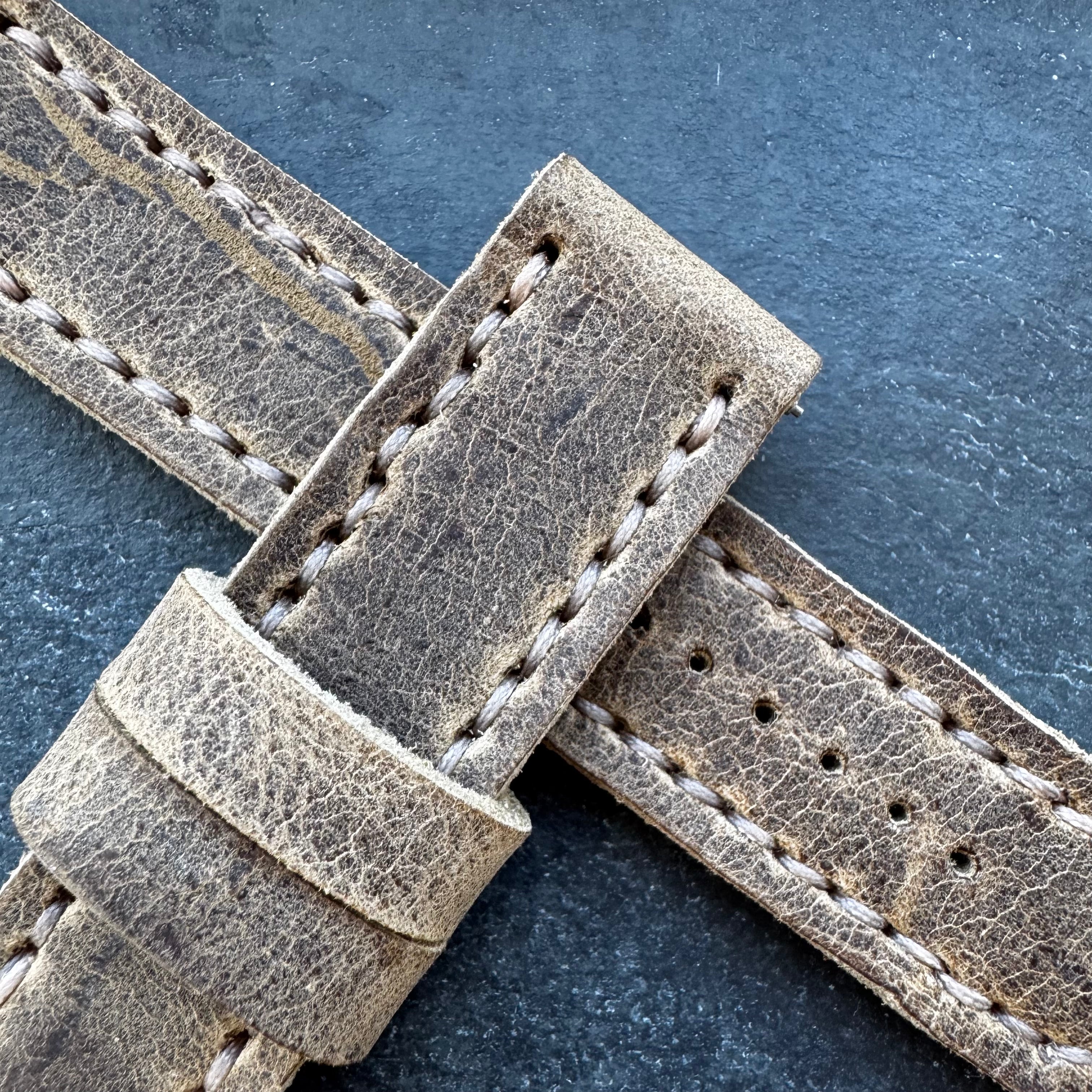 A high-magnification, detailed view of the stitching and the rugged, grained texture of the Wild African Kudu leather on the No. 44 AVIATOR Leather Watch Strap.