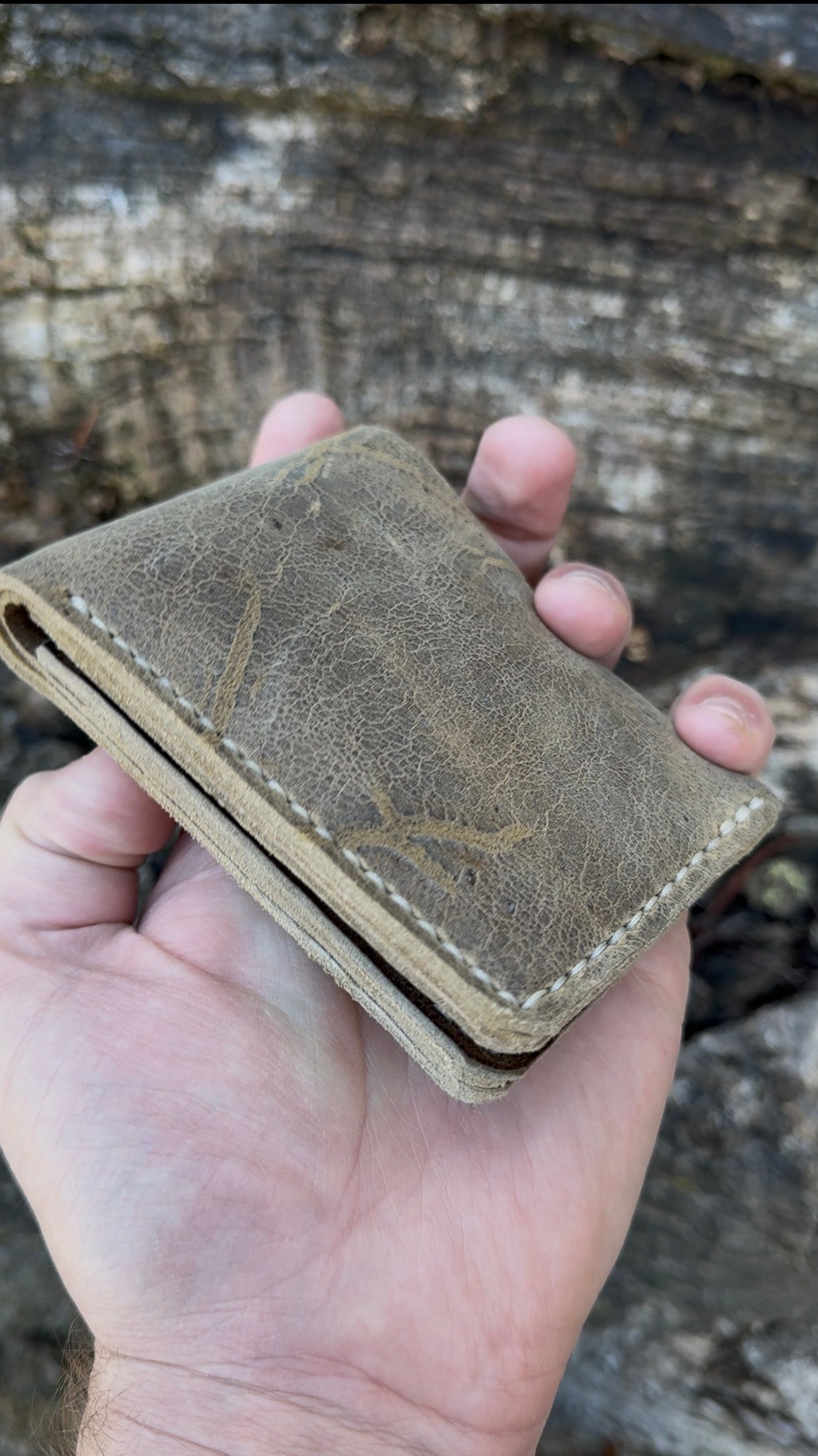 Handcrafted No. 2 Jagter field bifold wallet in rare Wild African Kudu leather, featuring unique natural hide markings and custom coin pouch configuration